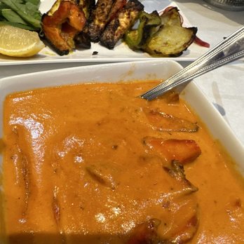 Bombay Grill signature dishes Chicken Tikka MasalaLamb BiryaniGarlic Naan